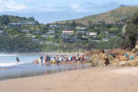 Photo for Whitianga, New Zealand - February 22, 2024: People visiting Hot Water Beach on the east coast of the Coromandel Peninsula, New Zealand. - Royalty Free Image