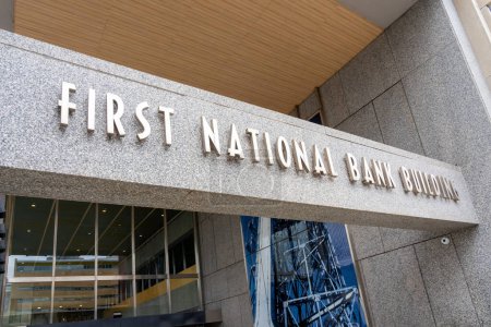 Photo for First National Bank Building sign is seen in downtown Saint Paul, Minnesota, USA, May 5, 2023. The building is an office building and has the tallest connecting skyway in the Twin Cities. - Royalty Free Image