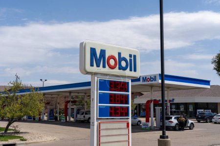 Photo for A Mobil gas station in Madison, Wisconsin, USA, May 4, 2023. - Royalty Free Image
