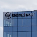 Bridges Trust logo sign on its headquarters office building in Omaha, NE, USA, May 7, 2023. Bridges Trust is an American trust and wealth management firm.