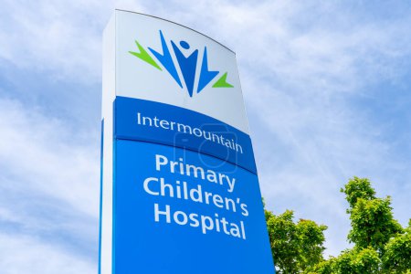 Photo for Intermountain Primary Children's Hospital sign with blue sky in background in Salt Lake City, Utah, USA - May 12, 2023, a nationally ranked pediatric acute care children's teaching hospital. - Royalty Free Image