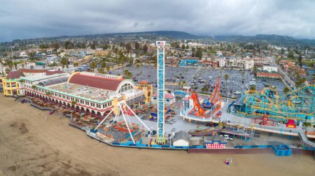 Photo for Santa Cruz Beach Boardwalks vintage rides and Looff Carousel and the Giant Dipper roller coaster. - Royalty Free Image
