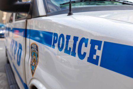 Foto de Police Vehicle in NYC, USA. Blue Color on the White Car. - Imagen libre de derechos