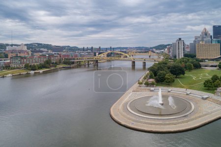 Photo for Point State Park and Fountain in Pittsburgh, Pennsylvania. Fort Pitt Bridge and Cityscape in Background - Royalty Free Image