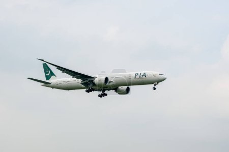 Photo for Pakistan International Airlines Boeing 777 AP-BMS landing in London Heathrow International Airport. - Royalty Free Image