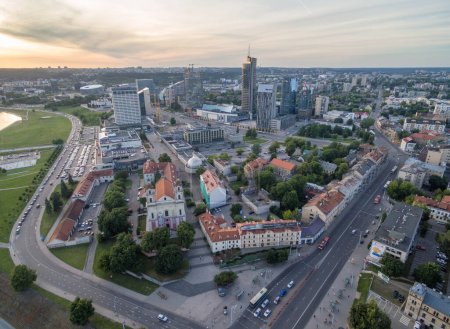 Photo for Vilnius Cityscape with Business District. Sunset Sky. Church of St. Archangel Raphael in Foreground - Royalty Free Image