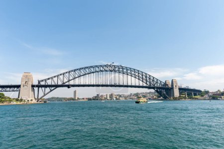 Foto de Sydney Architecture and Harbour Bridge with ferry. Wide Angle. Australia - Imagen libre de derechos