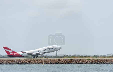 Photo for SYDNEY, AUSTRALIA - NOVEMBER 11, 2014: Sydnay International Airport With Take Off Airplane. Aircraft VH-OJS, Boeing 747-438, Qantas - Royalty Free Image