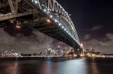 Photo for Sydney Harbour Bridge and Opera House. Long Exposure. Flowing Sky. Night - Royalty Free Image