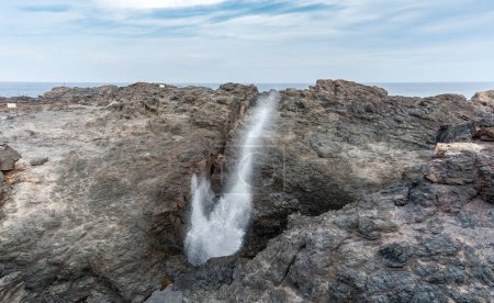 Photo for Kiama Blowhole in Action in Sydney with Blue Sky. Australia - Royalty Free Image