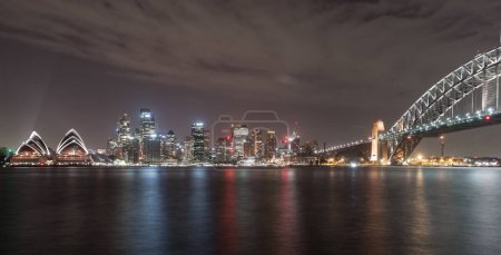 Photo for Sydney City at Night with Beautiful Downtown Skyline and Lights Reflections on Water. Opera House. Australia. - Royalty Free Image