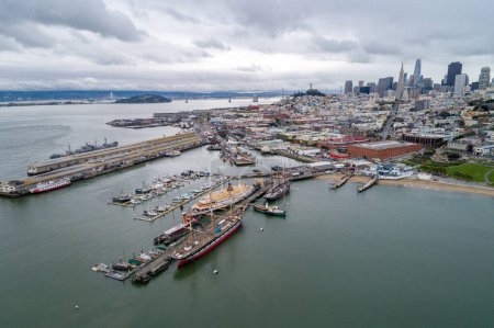 Photo for Aquatic Park Pier , Cove and Municipal Pier in San Francisco. Maritime National Historic Park in Background. Cityscape of San Francisco. California. - Royalty Free Image