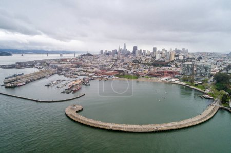 Photo for Aquatic Park Pier , Cove and Municipal Pier in San Francisco. Maritime National Historic Park in Background. Cityscape of San Francisco. California. - Royalty Free Image