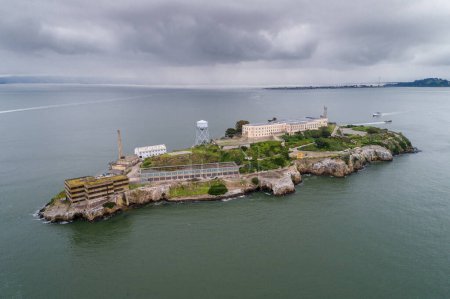 Photo for Aerial view of Alcatraz island in the San Francisco Bay. USA. The most famous Alcatraz Prison, Jail. Sightseeing Place. San Francisco Cityscape in Background. - Royalty Free Image