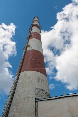 Photo for Chimney Smokestack and Cloudy Blue Sky - Royalty Free Image
