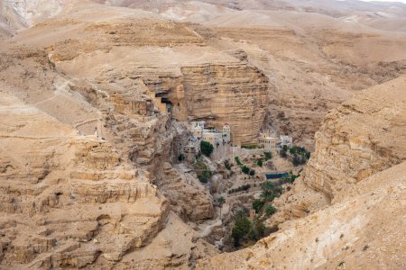 Photo for Wadi Qelt in Judean desert around St. George Orthodox Monastery, or Monastery of St. George of Choziba, Israel. The sixth-century cliff-hanging complex. - Royalty Free Image