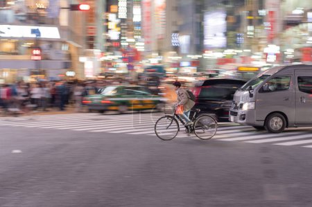 Photo for TOKYO, JAPAN - OCTOBER 30, 2019: Shibuya Crossing in Tokyo, Japan. The most famous intersection in the world. Blurry beacause of the panning. - Royalty Free Image