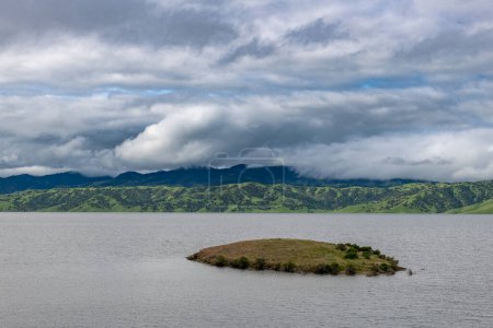 Photo for Upper Cottonwood Creek Wildlife Area. Beautiful Nature and Landscape. Green area with Cloudy Sky, San Luis Reservoir in Background. - Royalty Free Image
