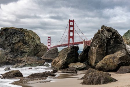 Photo for Golden Gate Bridge in San Francisco, California. The Golden Gate Bridge is a suspension bridge spanning the Golden Gate, the one-mile-wide strait connecting San Francisco Bay and the Pacific Ocean. Baker Beach in Background. USA - Royalty Free Image