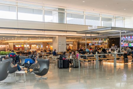Photo for SAN FRANCISCO, CALIFORNIA - APRIL 04, 2019: San Francisco International Airport Departures Area.  Restaurant in Background - Royalty Free Image