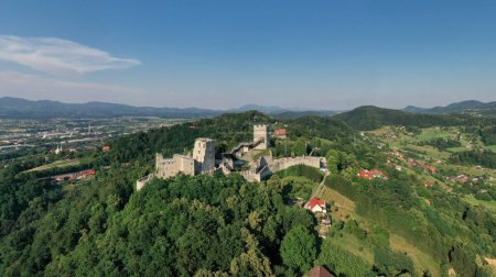 Photo for Celje Castle is a castle ruin in Celje, Slovenia, formerly the seat of the Counts of Celje. It stands on three hills to the southeast of Celje, where the river Savinja meanders into the Lasko valley - Royalty Free Image