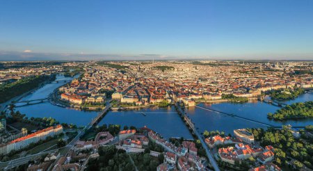 Photo for Prague Old Town in Czech Republic with Famous Sightseeing Places in Background. Charles Bridge Iconic 14th century Structure with View, Vltava river and Prague Cityscape. Must Visit City. Drone - Royalty Free Image
