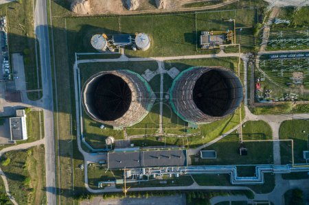 Téléchargez les photos : Cogeneration Power Plant Construction Area in Vilnius, Lithuania. Close to Gariunai Market.  Chimney in Background - en image libre de droit