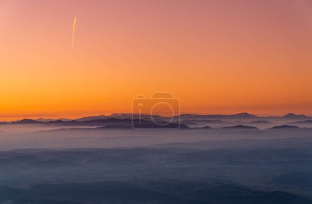 Téléchargez les photos : Zagreb Skyline in Croatia. Sunset Light Colorful Sky in Background. View from the top of Medvednica Mountain.  Haze Background. - en image libre de droit