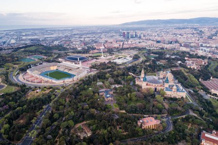 Foto de View Point Of Barcelona in Spain. On Montjuic hill, Mirador viewpoint. National Museum of Contemporary Art and Olympic Stadium in background. Drone - Imagen libre de derechos