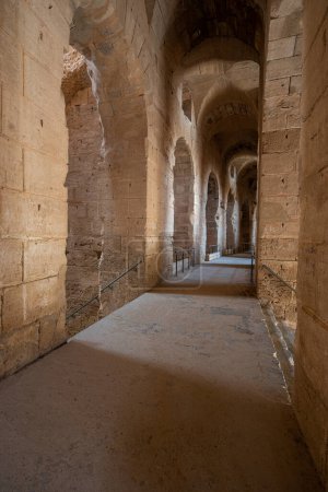 Photo for Interior of Amphitheatre of El Jem in Tunisia. Amphitheatre is in the modern-day city of El Djem, Tunisia, formerly Thysdrus in the Roman province of Africa. It is listed by UNESCO since 1979 as a World Heritage Site - Royalty Free Image