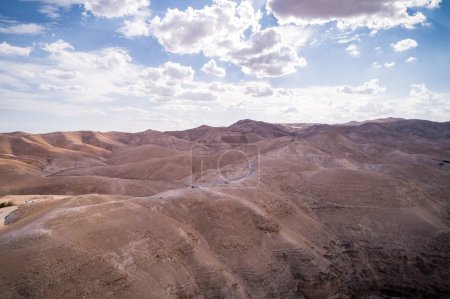 Téléchargez les photos : Desert in Israel. Mountains and Road in Background. Sandy Surface. - en image libre de droit