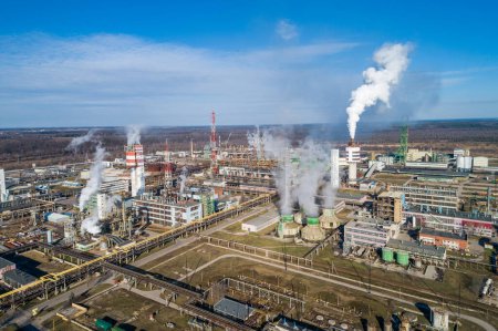 Photo for Chemistry Factory in Lithuania, Achema in Jonava City. Clear Blue Sky and Smoke in background. - Royalty Free Image