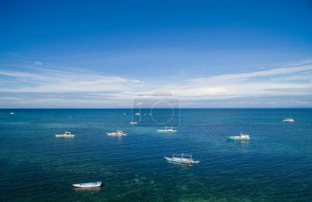 Photo for Sunny Day in Malapascua in Visayan Sea, One of Cebu Island. Sea water and Boats. Philippines - Royalty Free Image