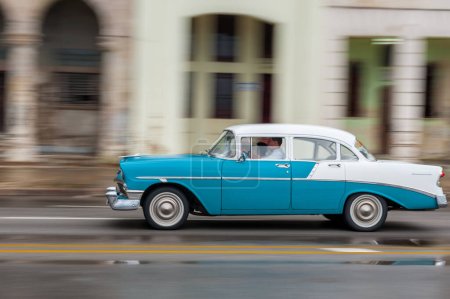 HAVANA, CUBA - OCTOBER 21, 2017: Old Car in Havana, Cuba. Retro Vehicle Usually Using As A Taxi For Local People and Tourist. Panning Blue Color Car