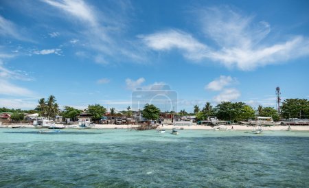 Photo for MALAPASCUA, PHILIPPINES - FEBRUARY 07, 2018: Beach in Malapascua with boats and sandy beach. Clear Blue Sky in Background. - Royalty Free Image