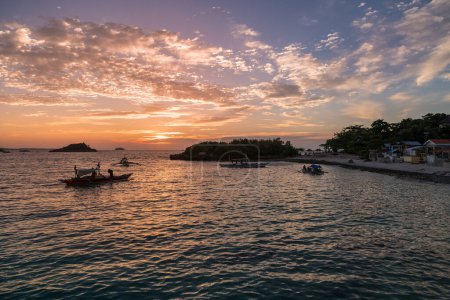 Photo for Sunset time in Malapascua island. Sunset colorful sky. Landscape photo with beach and boats in ocean water. - Royalty Free Image