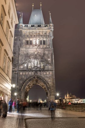 PRAGUE, CZECH - MARCH 12, 2016: Old Town Bridge Tower, Charles Bridge. Long Exposure, Prague, Czech. Blurry people because of long exposure