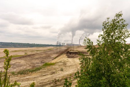 Photo for Coal-fired power plant and open-pit mine in Bechatw, Poland. - Royalty Free Image
