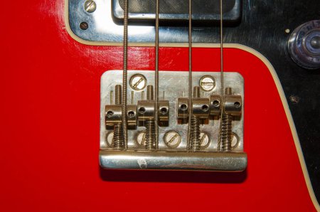 Photo for Electric bass guitar red color with string on fingerboard for rock music. - Royalty Free Image