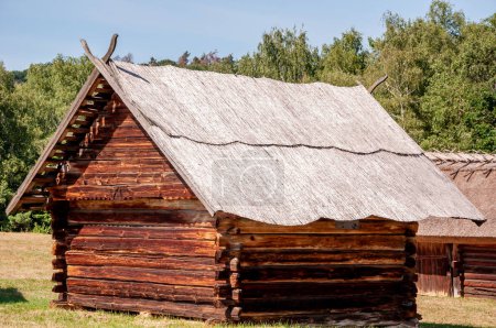 Authentic Ukrainian house in countryside. Summer village in Ukraine. Old folk thatched house. Ukrainian traditional rustic house. Rural countryside in summer ranch. Architecture Pyrohiv.