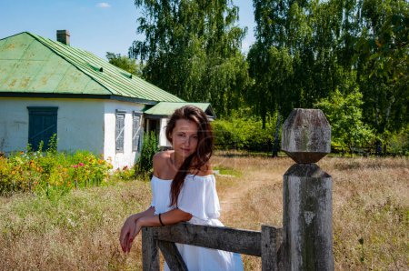 Photo for Countryside beautiful woman in summer at village cottage house outdoor. - Royalty Free Image