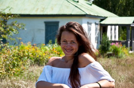 Photo for Countryside happy girl woman in summer Ukrainian village. Summer vacation outdoor. - Royalty Free Image