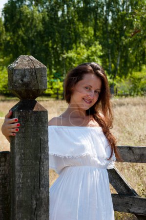 Photo for Countryside happy girl woman in summer Ukrainian village ranch or farm. Summer vacation outdoor. - Royalty Free Image