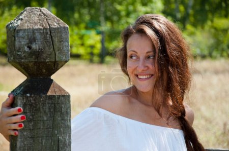 Photo for Countryside carefree girl woman in summer Ukrainian village ranch or farm. Summer vacation outdoor. - Royalty Free Image