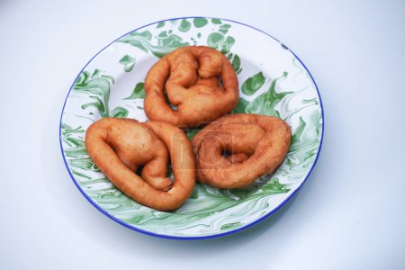 A fried and sweet-tasting market snack made from flour and other ingredients is called chicken intestines