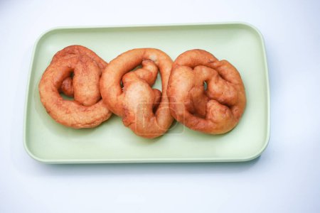 A fried and sweet-tasting market snack made from flour and other ingredients is called chicken intestines