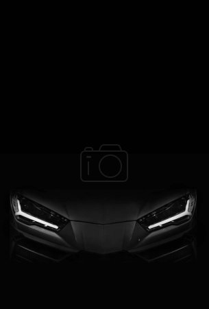 Photo for Silhouette of black sports car with LED headlights on black background - Royalty Free Image