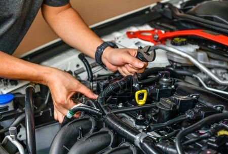 A professional mechanic checking car engine