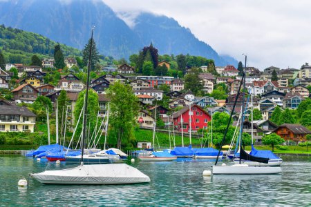 Photo for Beautiful harbor city Spiez is a small town on Lake Thun. Located on the southern coast, just 18 km from Interlaken. - Royalty Free Image