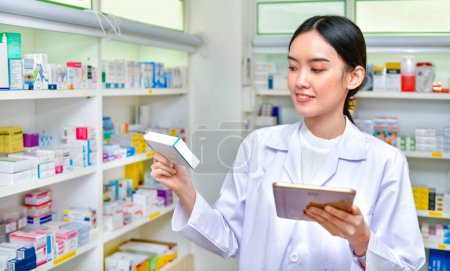 Pharmacist holding computer tablet Using for filling prescription in pharmacy drugstore.